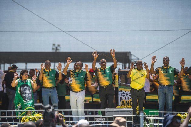 (FromL) Deputy secretary-general Jessie Duarte, secretary-general Ace Magashle, national chairperson Gwede Mantashe, ANC and state president Cyril Ramaphosa, ANC deputy president David Mabuza and treasurer-general Paul Mashatile wave to the crowd of ANC supporters at the Absa Stadium in East London during the ANC's 106th-anniversary celebrations on January 13, 2018.
