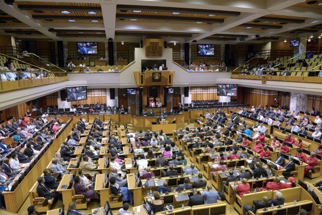 Cyril Ramaphosa (C), newly sworn-in South African president, addresses Parliament on February 20, 2018.