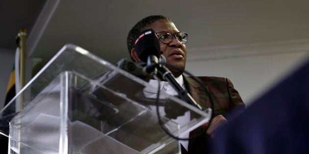 Police Minister Fikile Mbalula looks on as he attends a public meeting with the Marikana Informal Settlement residents of the Philippi East township in Philippi East on the outskirts of Cape Town on October 3, 2017, following the killing of 11 people in a series of weekend shootings.