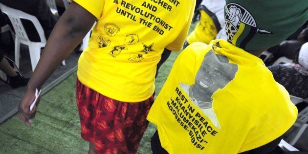 A woman wears a t-shirt bearing the face of slain ANC ward candidate Khanyisile Ngobese-Sibisi, who was shot and killed last year while giving out blankets to the elderly for Mandela Day in Ladysmith.