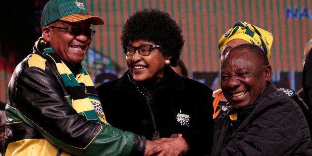 Winnie Madikizela Mandela chats with party president Jacob Zuma (L) and his deputy Cyril Ramaphosa ahead of the African National Congress's 5th National Policy Conference at the Nasrec Expo Centre in Soweto.