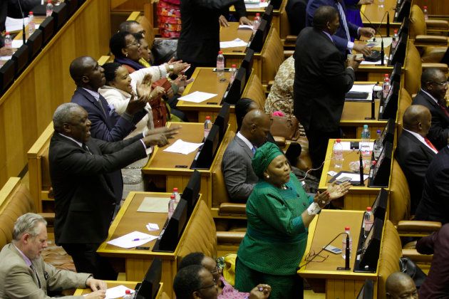 ANC MPs celebrate following the results of a vote of no confidence in President Jacob Zuma on August 8, 2017.