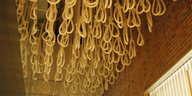 The Apartheid Museum. Gold Reef City. Johannesburg. South Africa. Rows of nooses hang from the ceiling as a reminder of the days when the death penalty still existed in South Africa.