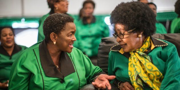 Africa National Congress stalwart Winnie Madikizela Mandela (R) listens to ANC Women League president Bathabile Dlamini while supporters gather in Soweto on September 26, 2016, to celebrate her 80th birthday.