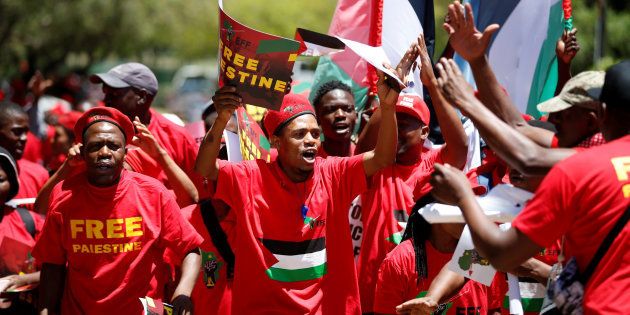 Members of South Africa's Economic Freedom Fighters party (EFF), carry placards during a march to the Israel embassy in Pretoria, South Africa, November 2, 2017.