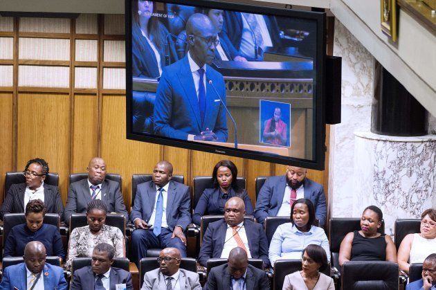 Parliamentarien listen to South African Finance Minister Malusi Gigaba as he delivers the 2018 Budget speech in the National Assembly on February 21, 2018, in Cape Town.