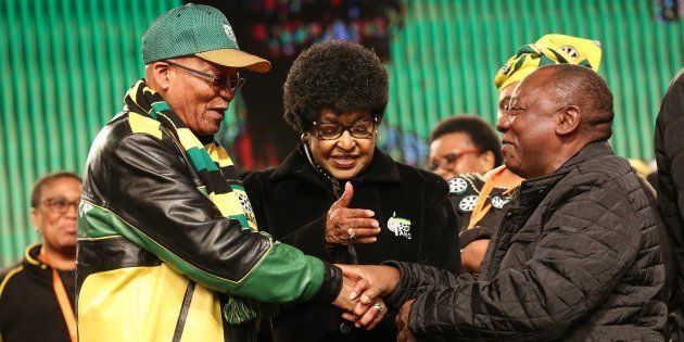 Stalwart Winnie Madikizela-Mandela urges ANC President Jacob Zuma and his deputy Cyril Ramaphosa to hold hands during the African National Congress (ANC) 5th national policy conference at the Nasrec Expo Centre on June 30, 2017, in Johannesburg, South Africa.