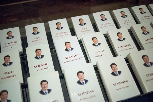 Chinese President Xi Jinping's book, translated into foreign languages, is on display during the opening ceremony of a high-level meeting held by the Communist Party of China (CPC) at the Great Hall of the People on December 1, 2017.