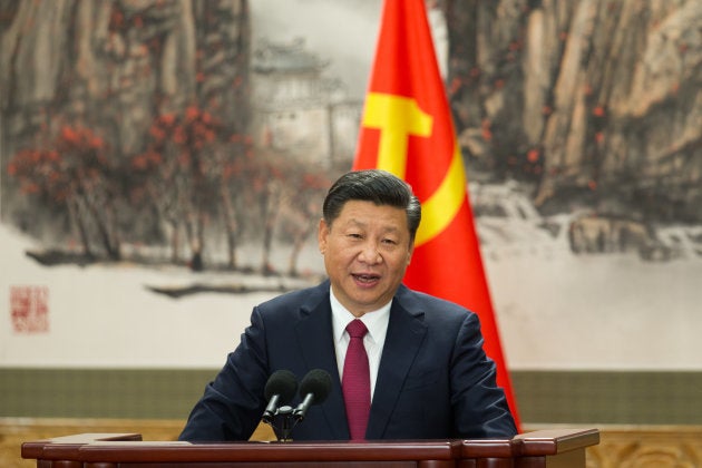 Chinese President Xi Jinping speaks at the podium during the unveiling of the Communist Party's new Politburo Standing Committee at the Great Hall of the People on October 25, 2017 in Beijing, China.