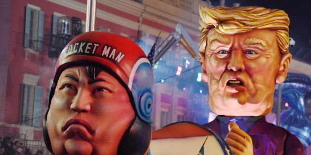 A float with effigies of North Korean leader Kim Jong Un and U.S. President Donald Trump is paraded through the crowd during the 134th Carnival parade in Nice, France February 20, 2018.