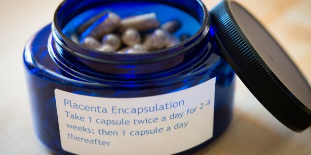 Midwife Claudia Booker, 65, prepares a placenta for encapsulation in her Washington, D.C. home on Friday, July 25 2014. Some new mothers consume their placentas to obtain perceived health benefits.