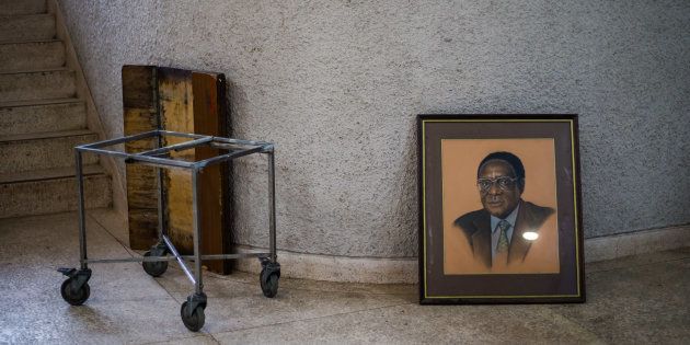 A picture taken on December 14, 2017 shows a portrait of former Zimbabwe President Robert Mugabe after it was removed from the hall during the 107th annual conference of the Zanu-PF Central Committee at the party headquarters in Harare on December 14, 2017.