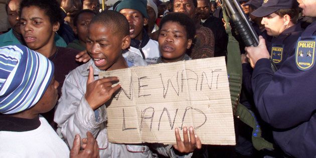 Residents of an informal settlement near Cape Town demonstrate against poor housing conditions.