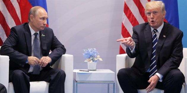 U.S. President Donald Trump gestures as he meets with Russian President Vladimir Putin during the their bilateral meeting at the G20 summit in Hamburg, Germany July 7, 2017. REUTERS/Carlos Barria