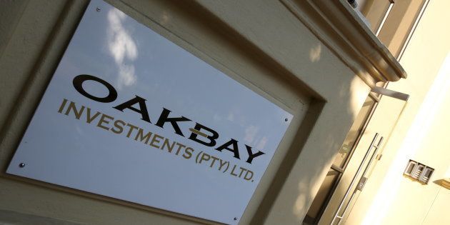 A logo of Oakbay Investments is seen at the entrance of their offices in Sandton, outside Johannesburg, April 13, 2016.