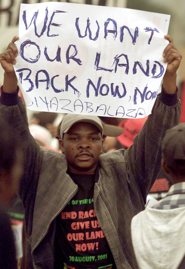 Demonstrators demand land during a march outside the opening session of the World Conference Against Racism (WCAR) in Durban.