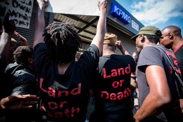 Members of political party Black First Land First (BLF) demonstrate in front of the offices of financial audit, tax and advisory company KPMG in Johannesburg, South Africa, on September 28, 2017.