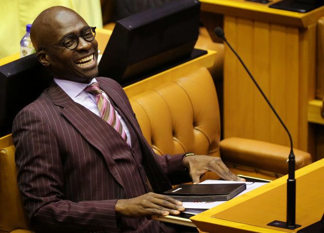 Finance Minister Malusi Gigaba reacts while listening to South African President Cyril Ramaphosa speak in parliament in Cape Town, South Africa February 20, 2018. REUTERS/Sumaya Hisham