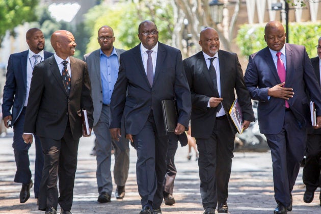 Nhlanhla Nene before he delivered his only budget speech on 25 February 2015, with Tom Moyane, SARS commissioner (left), Mcebisi Jonas (deputy minister) and Lungisa Fuzile (Treasury director-general).