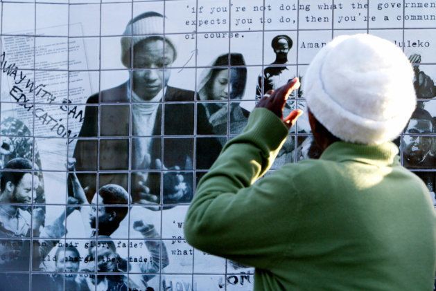 Mrs Nomkhitha Mashinini looks at the collage made in honour of his son, Tsietsi Mashinini, one of the leaders of the Soweto student uprising, 16 June 2006 in Johannesbourg. PHOTO: GIANLUIGI GUERCIA