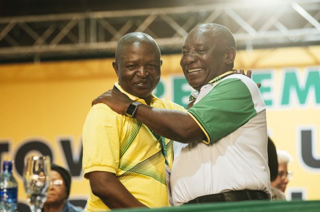 Cyril Ramaphosa embraces David Mabuza, newly appointed deputy president of the African National Congress party (and now also of South Africa) on stage during the 54th national conference of the African National Congress party in Johannesburg, South Africa, on Monday, Dec. 18, 2017.