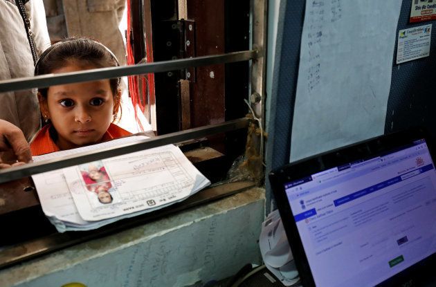 A girl waits for her turn to enrol for the Unique Identification (UID) database system, also known as Aadhaar, at a registration centre in New Delhi, India, January 17, 2018. Picture taken January 17, 2018.