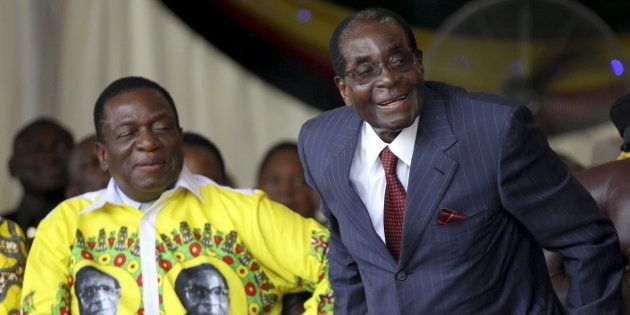 Robert Mugabe (R) shares a joke with President Emmerson Mnangagwa during Mugabe's birthday celebrations at Great Zimbabwe in Masvingo. February 27, 2016.