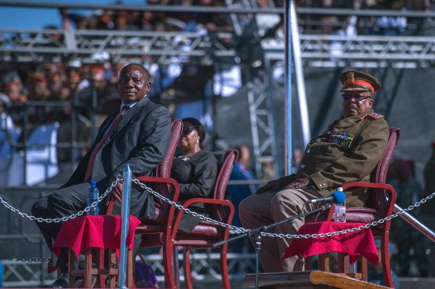 President Cyril Ramaphosa (L) watches the SANDF during Armed Forces Day on February 21, 2018 in Kimberley.