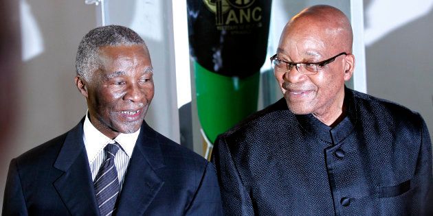 South Africa's President Jacob Zuma (R) pose with former president Thabo Mbeki during the lighting up ceremony of the centenary torch ahead of the upcoming African National Congress (ANC) centenary celebration in Bloemfontein January 8, 2012.