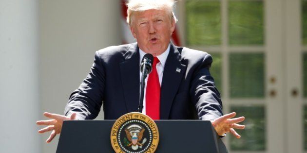 FILE PHOTO: U.S. President Donald Trump announces his decision that the United States will withdraw from the Paris Climate Agreement, in the Rose Garden of the White House in Washington, U.S., June 1, 2017. REUTERS/Kevin Lamarque/File Photo