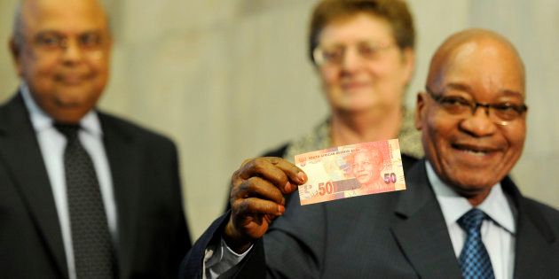 President Jacob Zuma during the announcement of a new line of bank notes at the South African Reserve Bank in Pretoria, with former finance minister Pravin Gordhan and the governor of the Reserve Bank, Gill Marcus.