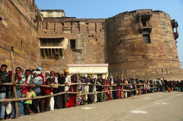 Indian Hindu devotees wait in queue outside OD Ford to worship an ancient Holy tree 'Akshayavat' on the auspicious day of 'Mauni Amavasya' during the annual Magh Mela festival in Allahabad on January 16, 2018.