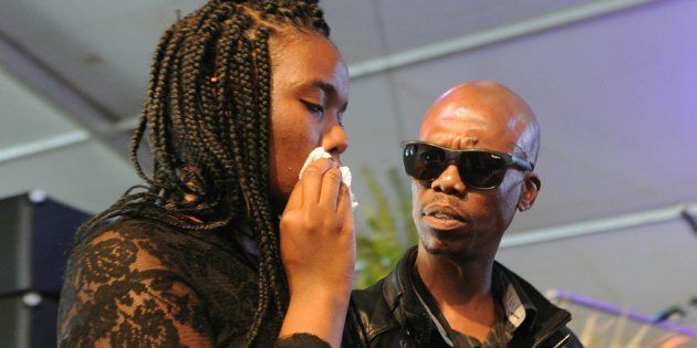 Ray Phiri's children, Phoolo and Lentle Phiri speak on behalf of his children during the memorial service at Mbombela Stadium on Thursday.