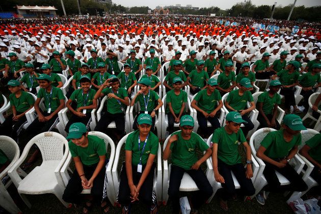 School students wait for Prime Minister Narendra Modi to address an election campaign meeting ahead of Gujarat state assembly elections, in Ahmedabad, India, December 3, 2017.