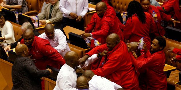 Party leader Julius Malema and members of his Economic Freedom Fighters (EFF) clash with Parliamentary security as they are evicted from the chamber in Cape Town, South Africa, May 17, 2016.