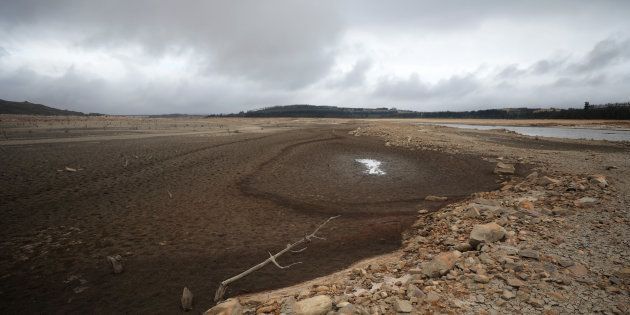 Pools of muddy water are seen at Theewaterskloof dam near Cape Town on January 20, 2018. The dam, which supplies most of Cape Town's potable water, is currently dangerously low.