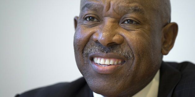 Lesetja Kganyago, Governor of the Reserve Bank of South Africa, poses for a photo in the Manhattan borough of New York October 6, 2015. Kganyago said on Tuesday the economy, while weak, will not go into recession this year and that expectations inflation will rise above its target range in 2016 are unlikely to draw a monetary policy response. REUTERS/Carlo Allegri