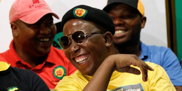 Julius Malema (R) gestures with Pule Mabe during a media briefing at Luthuli House in Johannesburg March 5, 2012.