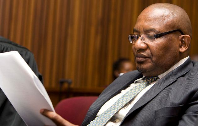 Former National Prosecuting Authority head Vusi Pikoli reads a document on August 6, 2009 in Johannesburg.