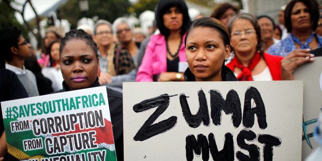 Demonstrators protest against South African President Jacob Zuma's firing of Finance Minister Pravin Gordhan, outside Parliament in Cape Town, South Africa, March 31, 2017. REUTERS/Mike Hutchings