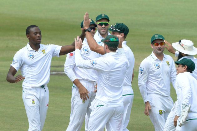 Kagiso Rabada of the Proteas celebrates the wicket of Tim Paine of Australia with his team mates during day 2 of the 1st Sunfoil Test match between South Africa and Australia at Sahara Stadium Kingsmead on March 02, 2018 in Durban. (Photo by Lee Warren/Gallo Images/Getty Images)