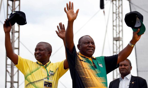 President of the ANC Cyril Ramaphosa and his deputy David Mabuza (L) wave to supporters ahead of the ANC's 106th anniversary celebrations in East London, South Africa, January 13, 2018.