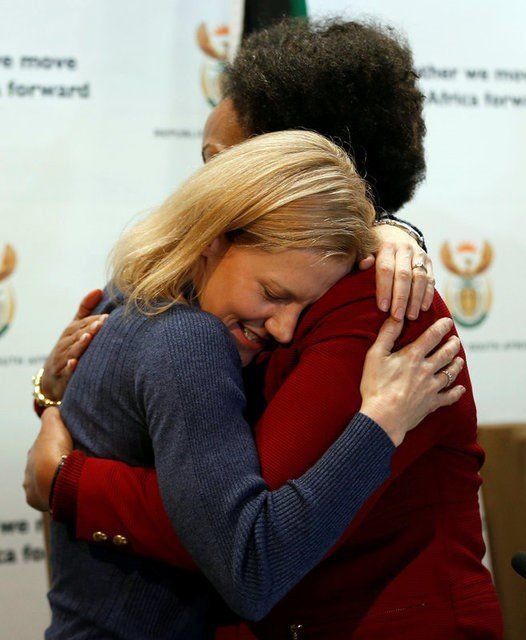 Catherine McGowan, wife of South African Stephen McGowan, who was kidnapped by al Qaeda from the Mali tourist town of Timbuktu in 2011 and has been released and is back home, hugs foreign minister Maite Nkoana-Mashabane after a media briefing in Pretoria, South Africa August 3, 2017. REUTERS/Siphiwe Sibeko