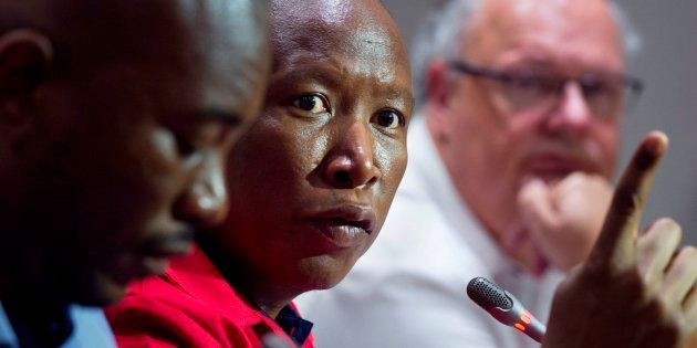 EFF leader Julius Malema flanked by DA leader Mmusi Maimane (L) and Corne Mulder (R) of the Freedom Front Plus (FF+).