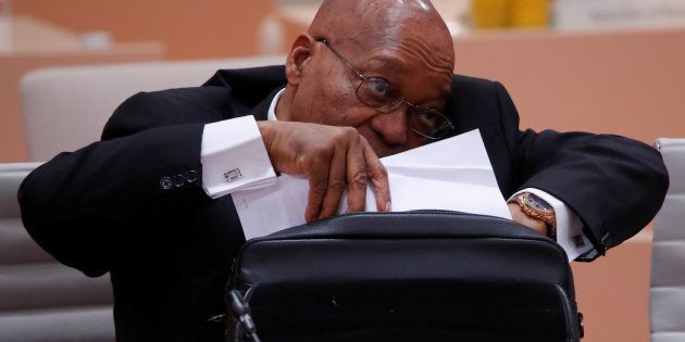 South African President Jacob Zuma takes out files before a working session at the G20 leaders summit in Hamburg, Germany July 8, 2017. Photo: REUTERS/Wolfgang Rattay