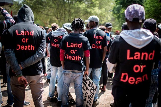 Members of political party Black First Land First (BLF) wear shirt with the lettering 'Land or Death' as they prepare to march.