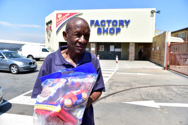 Customers return products to Enterprise outlet in South Africa. (Photo by Lucky Morajane/Foto24/Gallo Images/Getty Images)