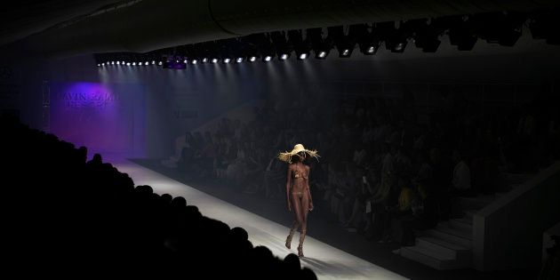 Model Mala Bryan walks during a show with the South African designer Gavin Rajah during the Mercedes-Benz Joburg Fashion Week on March 6, 2015 in Melrose Arch.