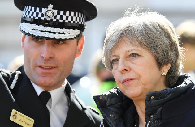 Britain's Prime Minister Theresa May (R) talks with Wiltshire Police Chief Constable Kier Pritchard in Salisbury, southern England, on March 15, 2018, as she is shown the areas where former Russian double agent Sergei Skripal and his daughter Yulia went to, and were discovered at, on March 4, following an apparent nerve-agent attack. Britain expelled 23 Russian diplomats over the nerve agent poisoning of a former spy, and suspended high-level contacts, including for the World Cup, as the US joined it in blasting Moscow at the UN on March 14. British Prime Minister Theresa May told Britain's parliament that Russia had failed to respond to her demand for an explanation on how a Soviet-designed chemical, Novichok, was used in the English city of Salisbury on March 4. / AFP PHOTO / POOL / TOBY MELVILLE (Photo credit should read TOBY MELVILLE/AFP/Getty Images)