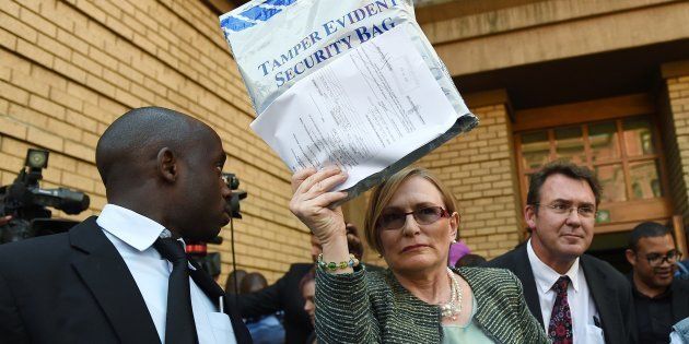 Helen Zille, then DA leader, outside the High Court in Pretoria on September 4, 2014, with the evidence bag containing the so-called